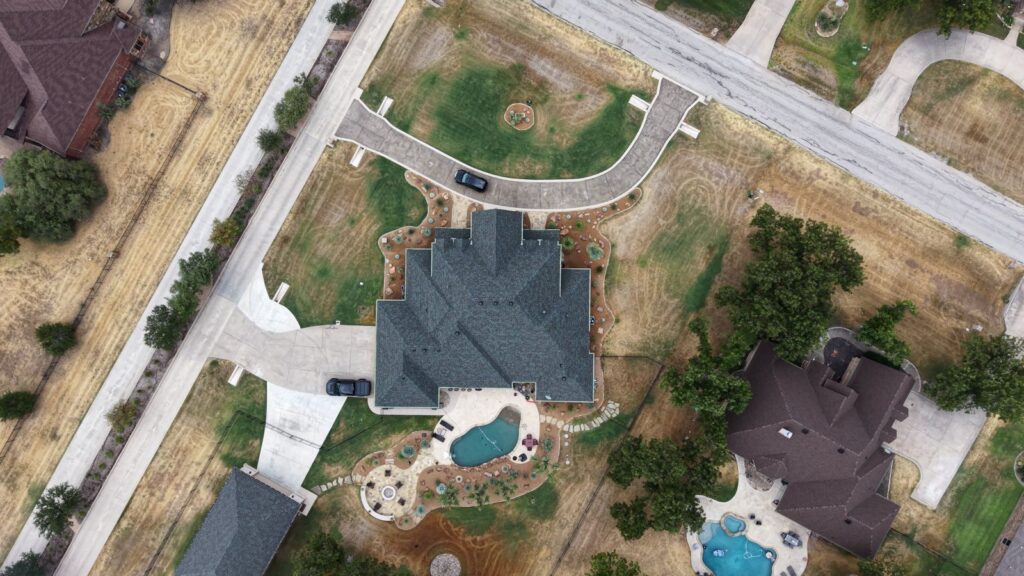 Aerial view of a completed roof replacement by Prometheus Power Solutions in North Texas